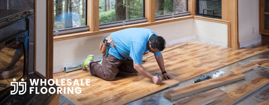 A flooring contractor installing vinyl flooring into a St. Pete home